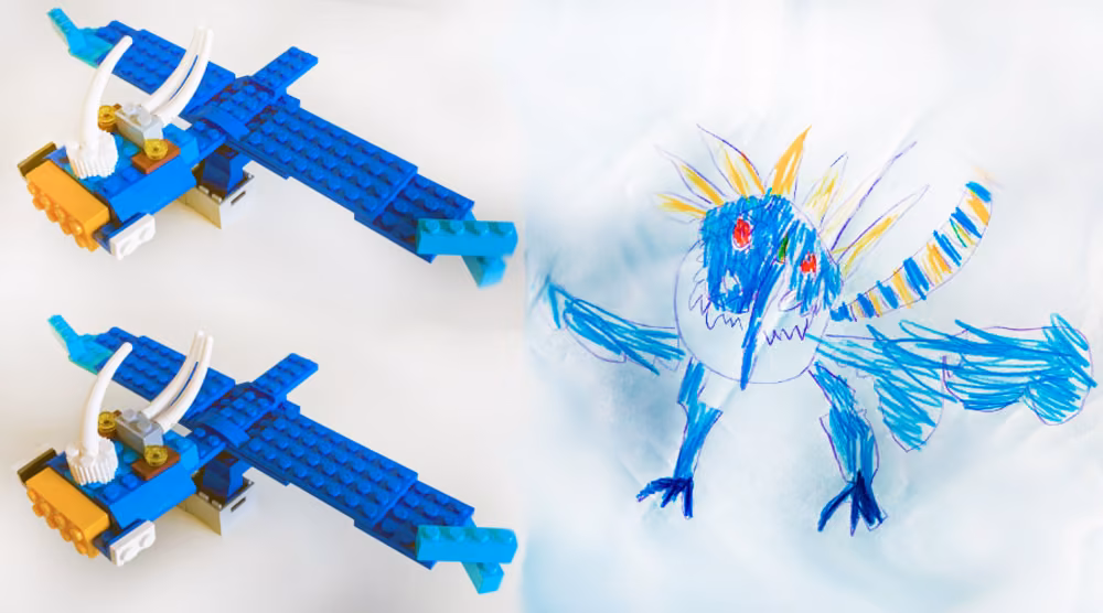 Two blue Lego aircraft beside a blue crayon drawing of a winged creature.